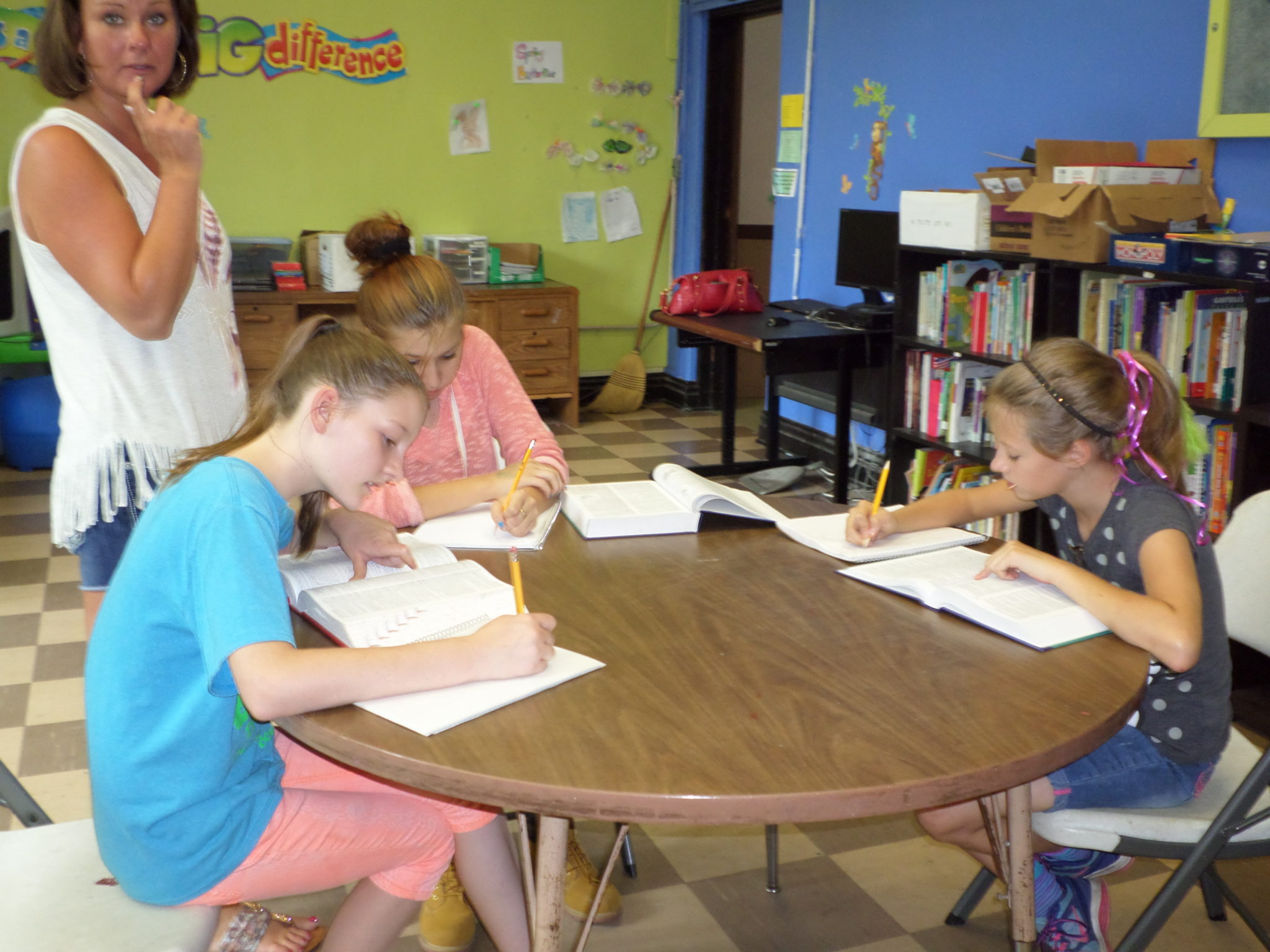 Children receiving academic assistance at school.