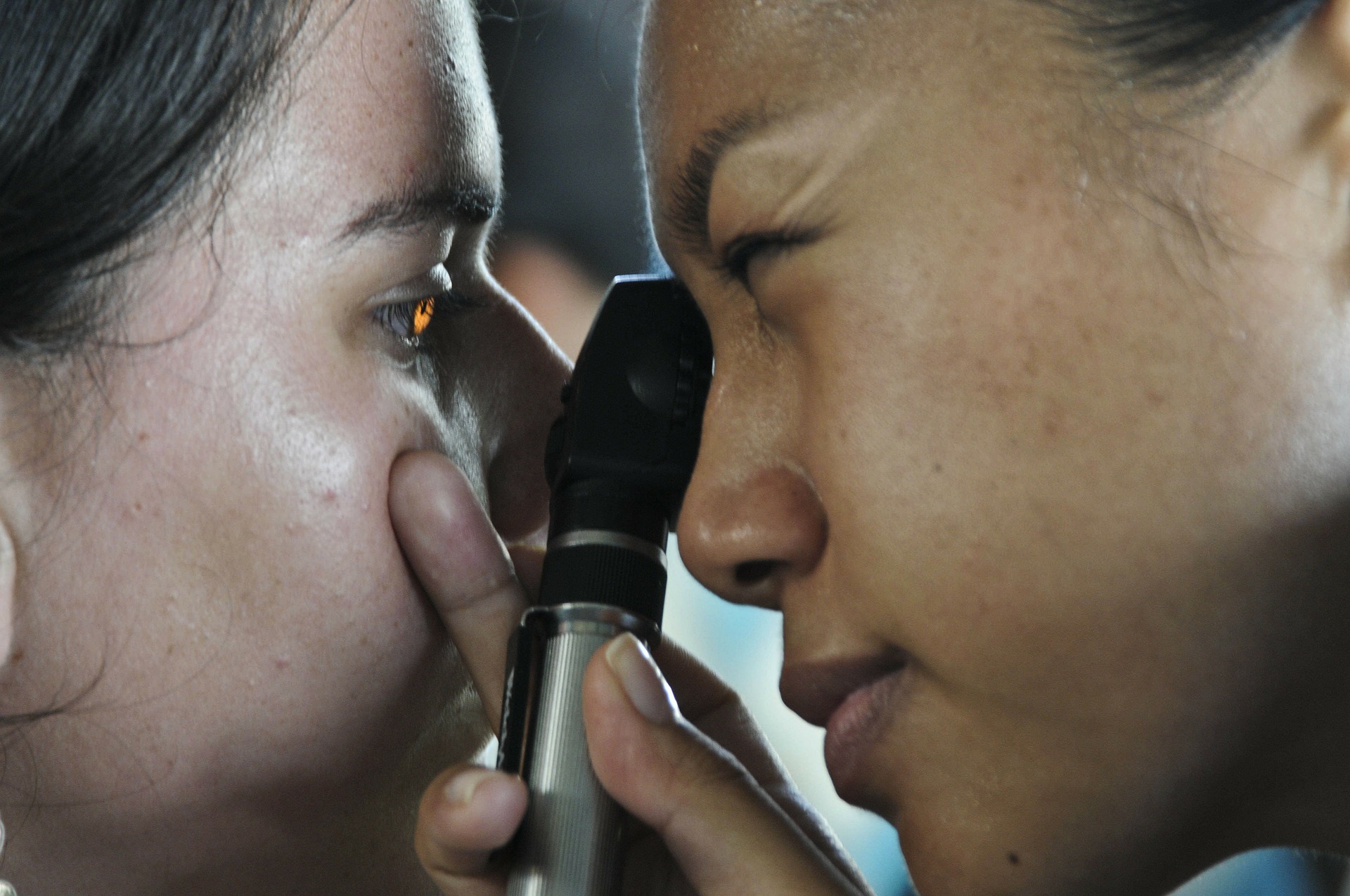 Optometrist performing eye exam on Appalachian student through Americans Helping Americans vision care program.