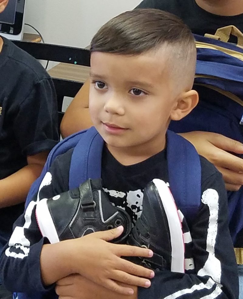 Little boy gets a pair of shoes in Appalachia