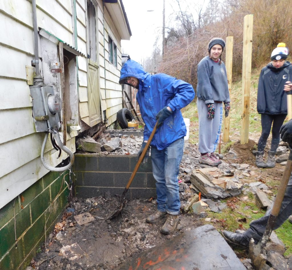 University of Richmond students dig a foundation for Jimmy’s handicap ramp in Shaft Holler, West Virginia.