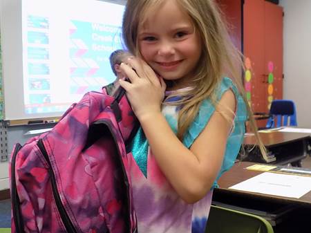 Little girl with free backpack in Appalachian Maryland