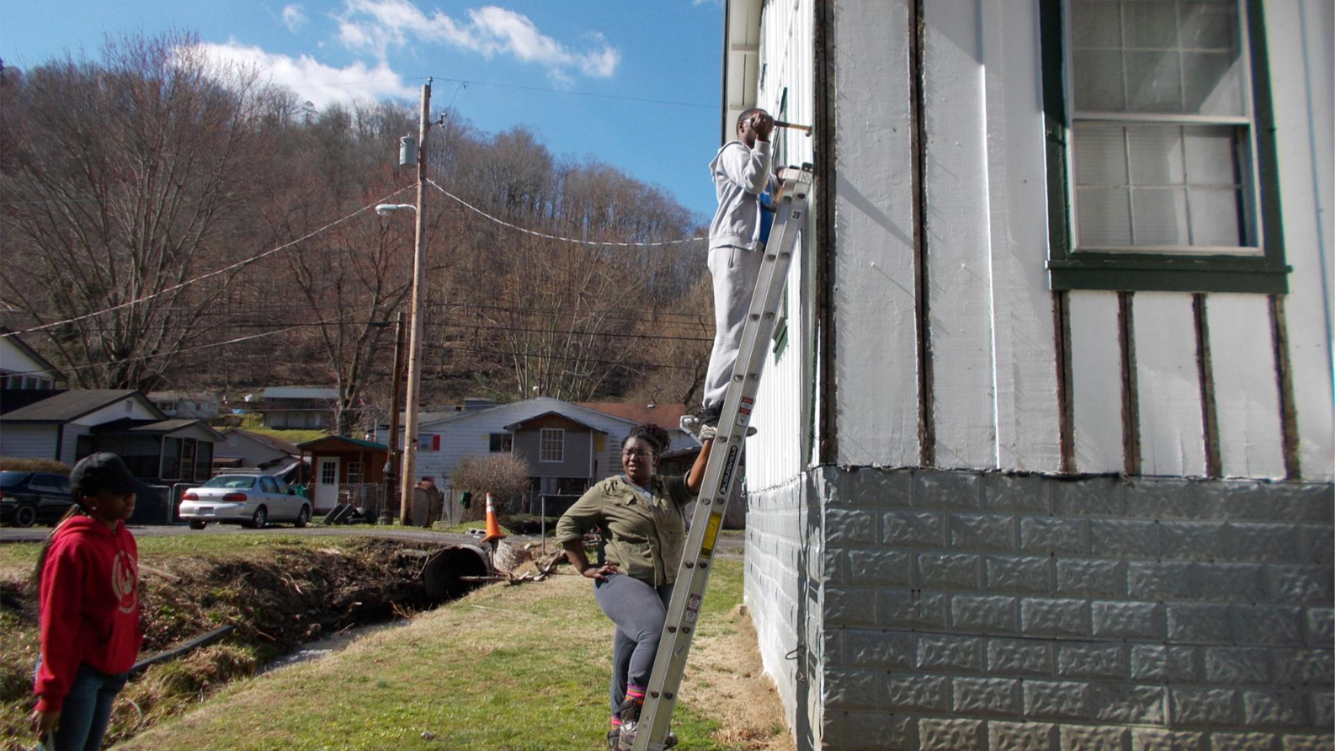 College student performing house rehab in rural Appalachia