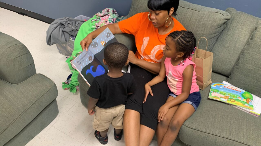 Mother and children read a book in North Carolina