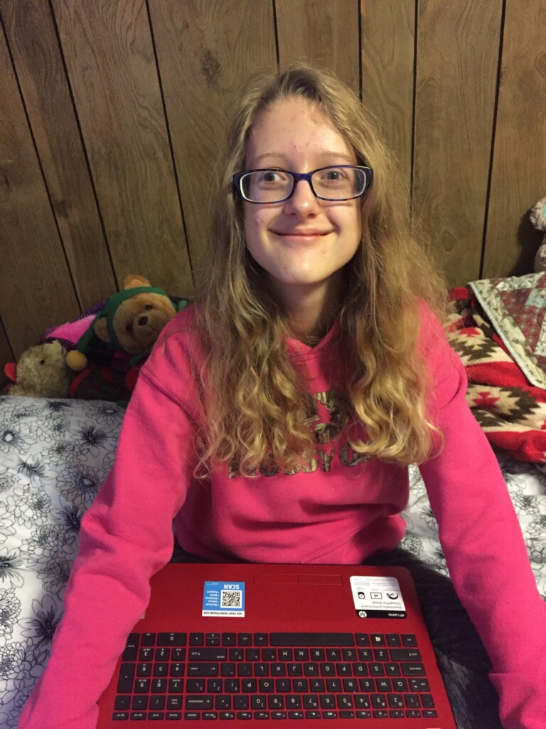 Student receives laptop computer as part of Digital Divide program in Kentucky