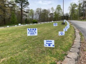 Commemorative signs for Lee County High School Class of 2020 graduation organized by Americans Helping Americans.