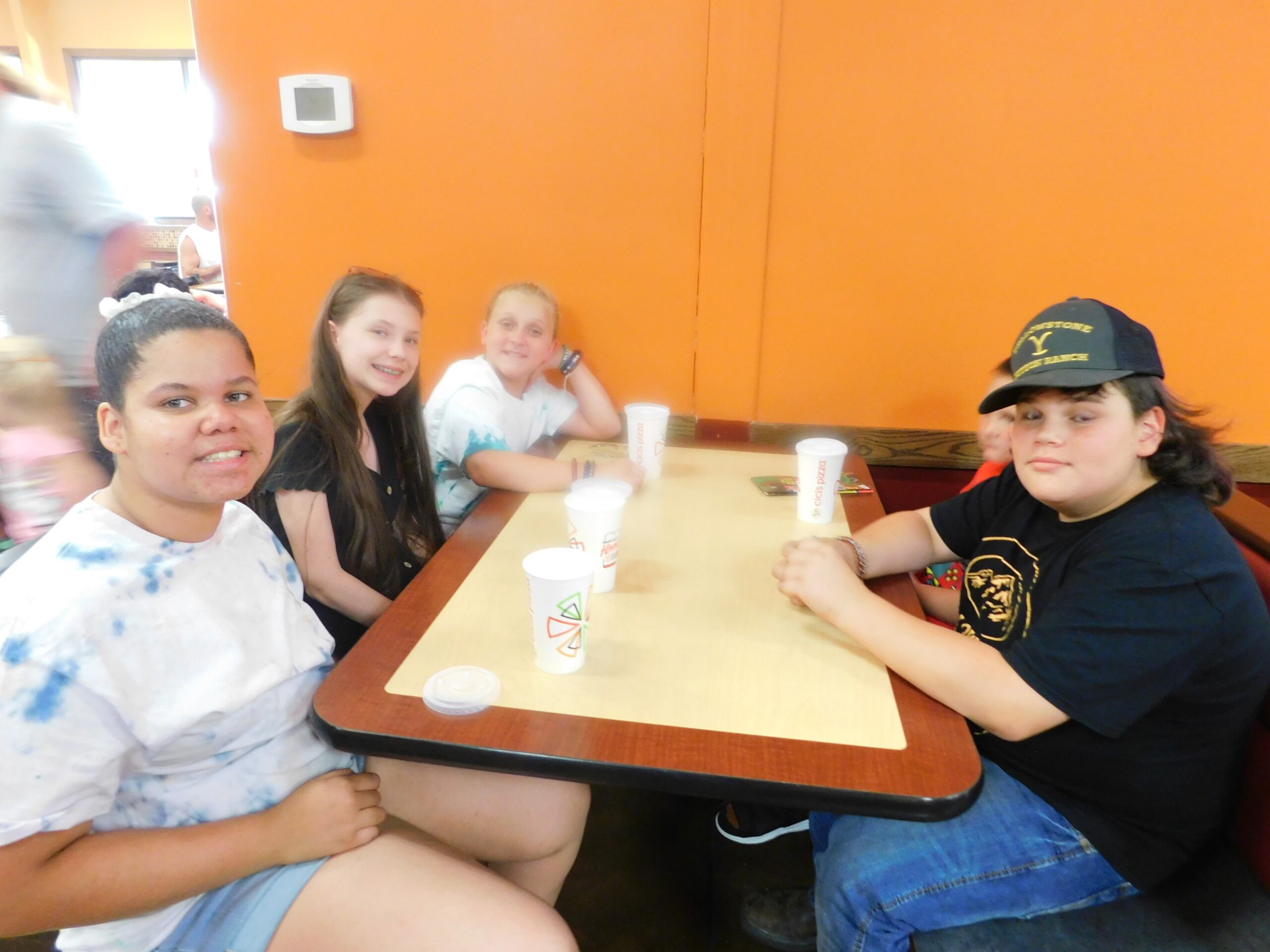 Children from McDowell County, WV, enjoy a pizza lunch during their summer camp trip to the Smoky Mountains.