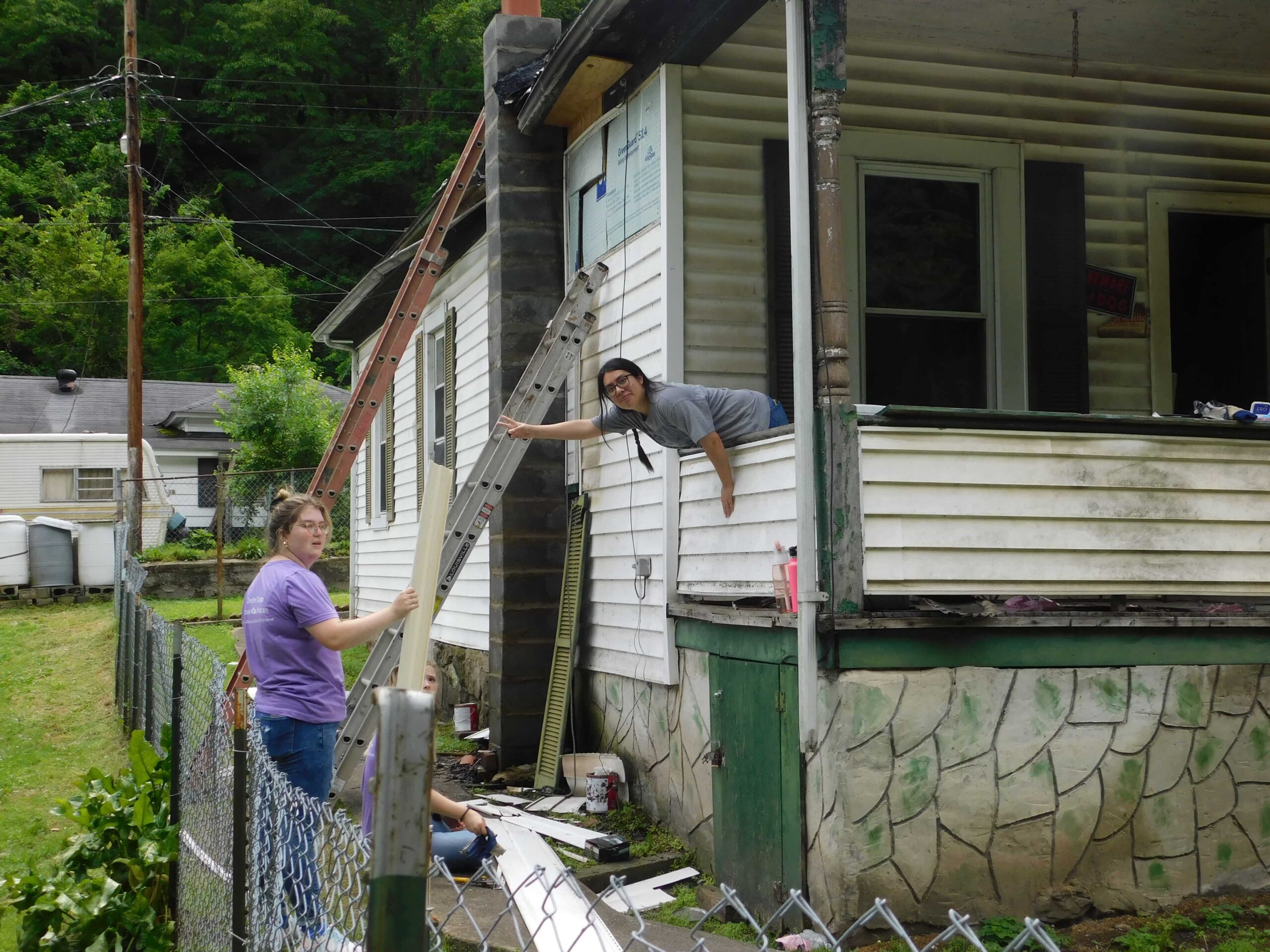Volunteers repairing a deteriorated home in Appalachia.