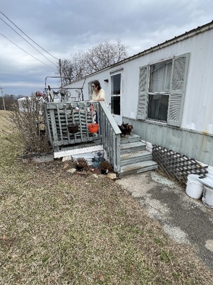 A veteran at a mobile home in Appalachia, a beneficiary of the Americans Helping Americans home repair program.