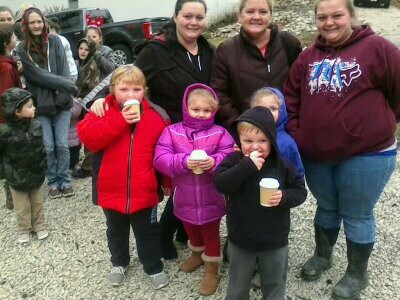 Appalachian families gathering for a holiday meal provided by Americans Helping Americans partners.