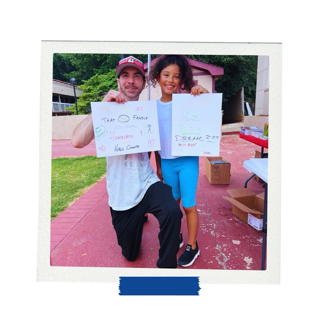 LAMP afterschool student and mentor display vision board posters during goal-setting activity in Gainesville, Georgia.