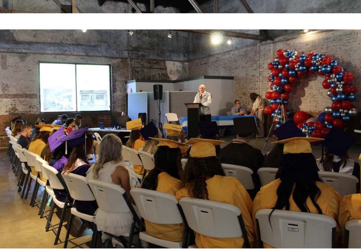 Lee County Area Technology Center students in caps and gowns at Americans Helping Americans Want2Work graduation ceremony.