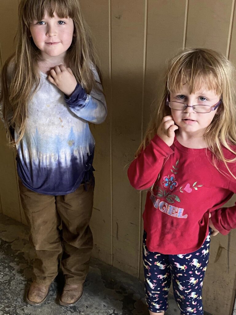 Two young sisters in Tazewell, Virginia stand together after their family receives hurricane relief.