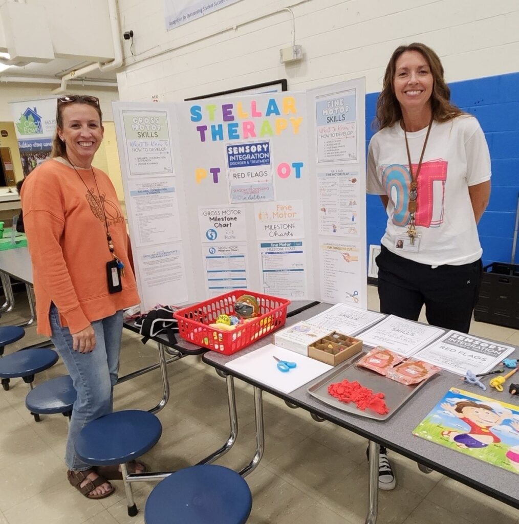 Therapists host a Stellar Therapy sensory integration booth at a school wellness event.