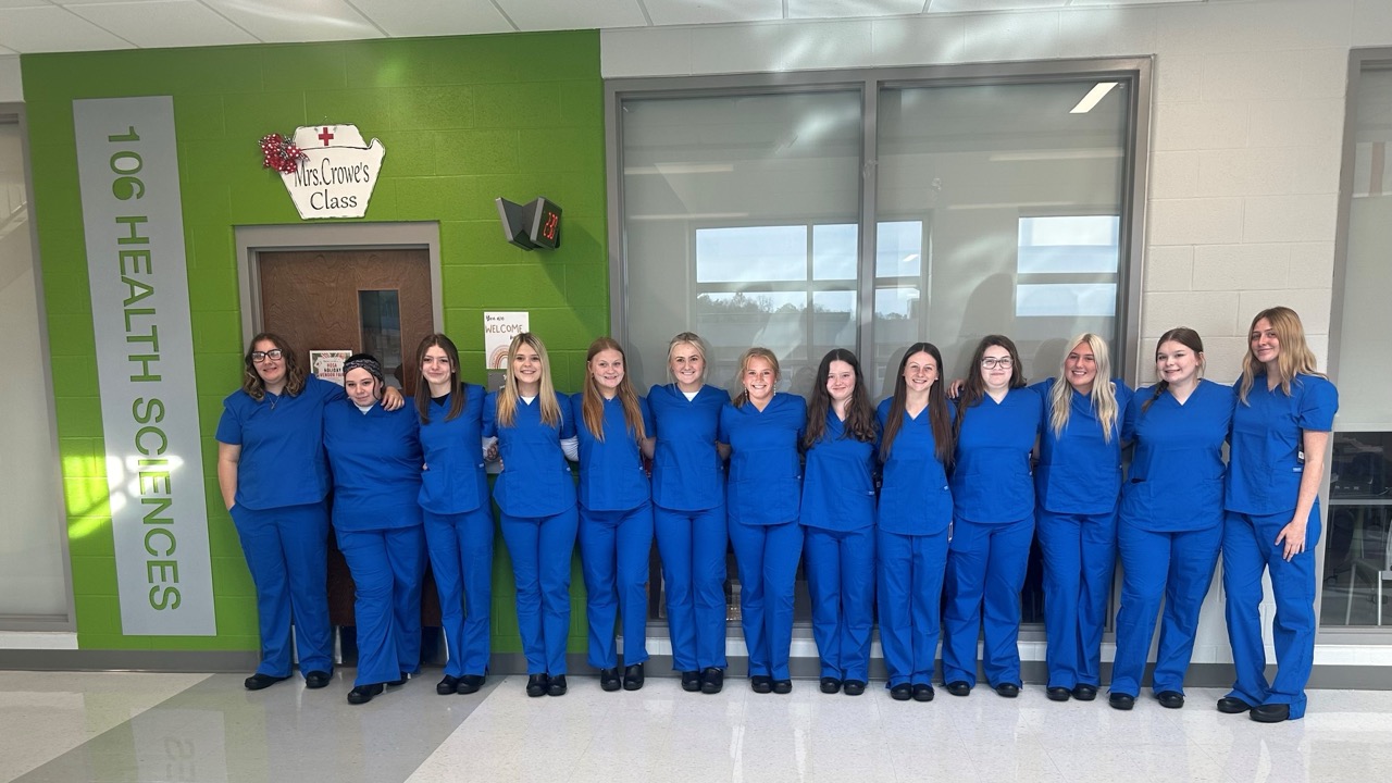 Appalachian nursing students in blue scrubs at a high school health sciences program supported by W2W.