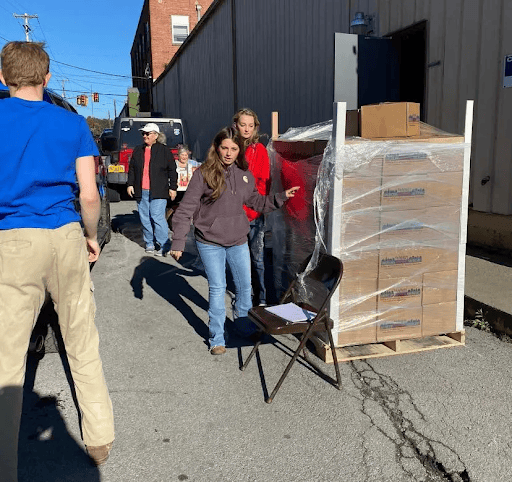 Volunteers unloading emergency relief boxes.