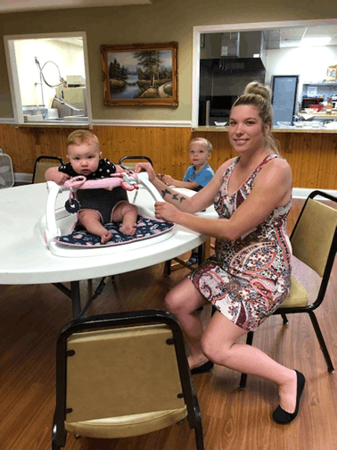 Mother with children at Samaritan House shelter receiving support and housing assistance