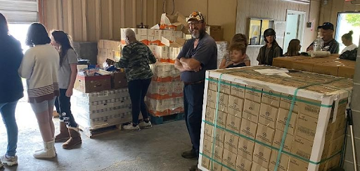 Community members receiving disaster relief supplies.