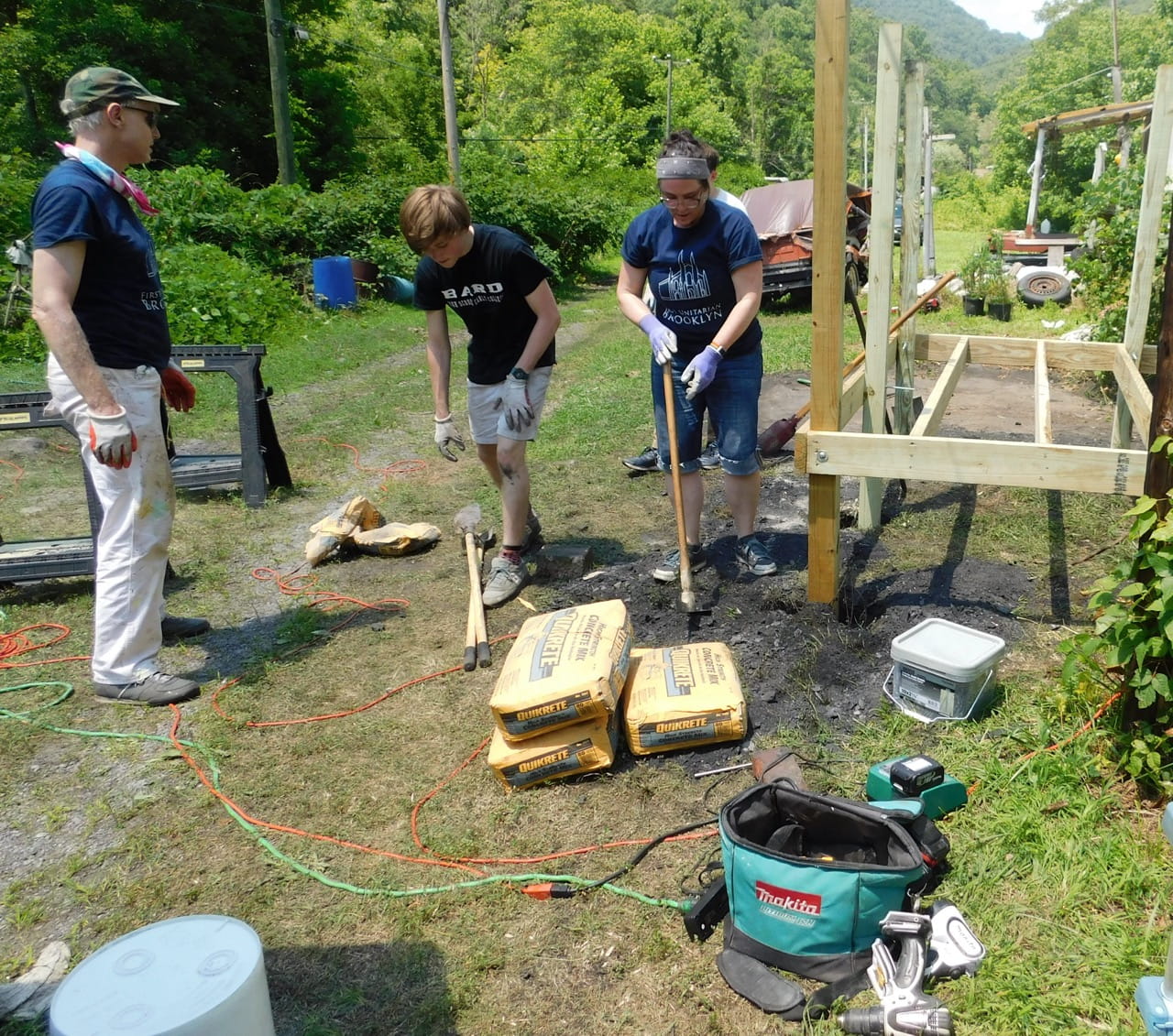 Volunteers repairing a home in rural West Virginia using construction tools during a community home rehabilitation project