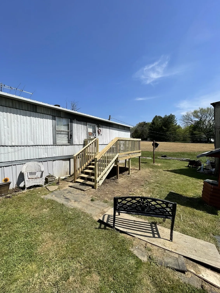 New wooden ramp and steps beside a mobile home during an Eastern Tennessee home repair project.