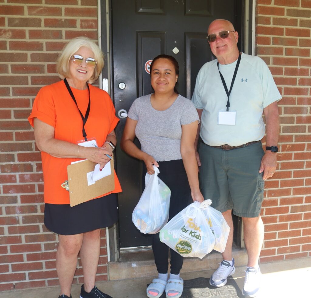 Children and volunteers help prepare Lunch Box program food bags in Appalachian Tennessee
