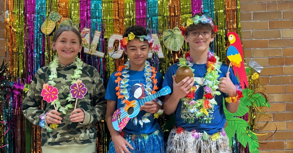 Children at a virtual Hawaii summer camp in Appalachia wearing leis and enjoying educational activities supported by Americans Helping Americans