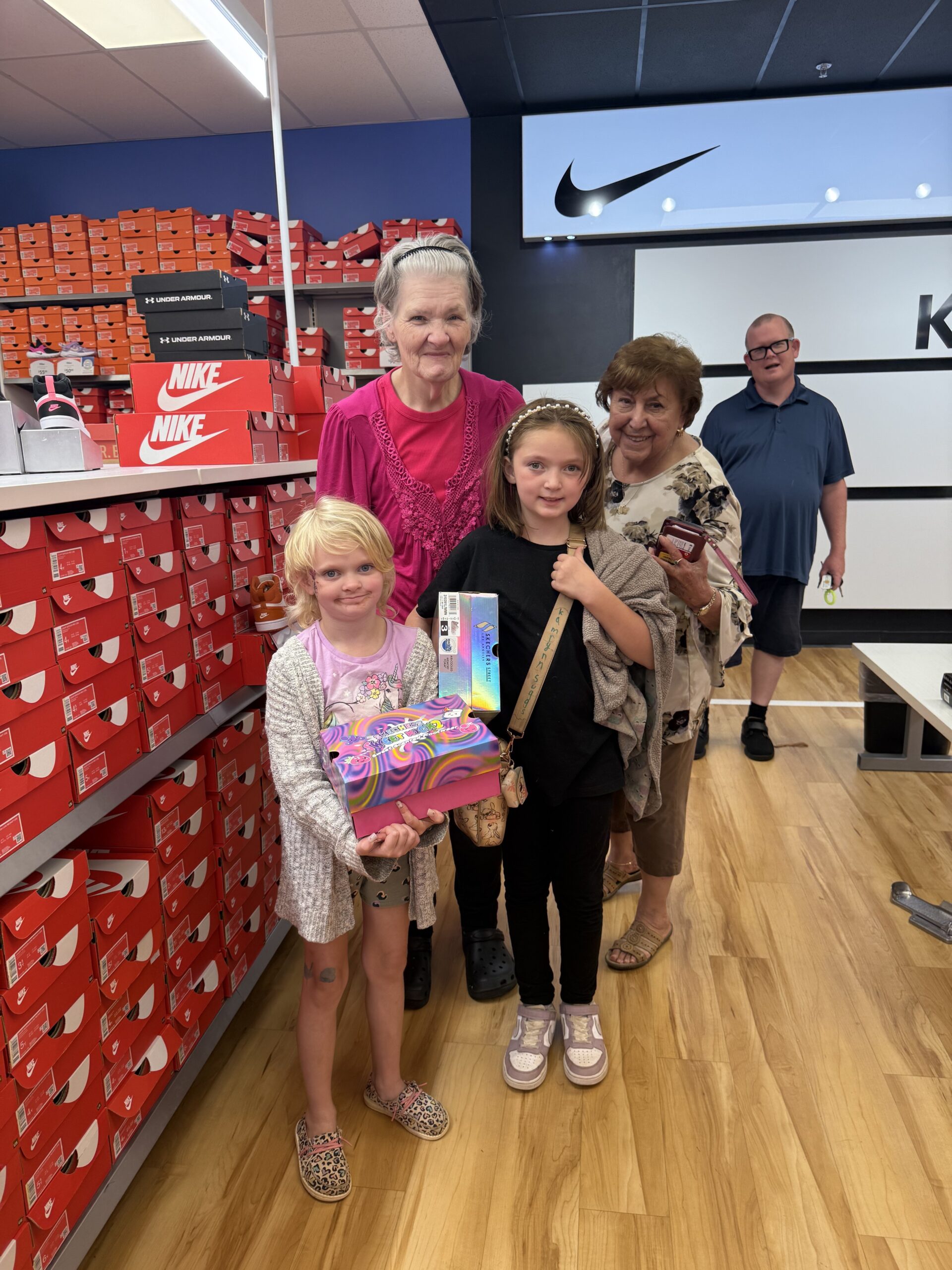 Child receiving a new pair of shoes through the Americans Helping Americans Barefeet program